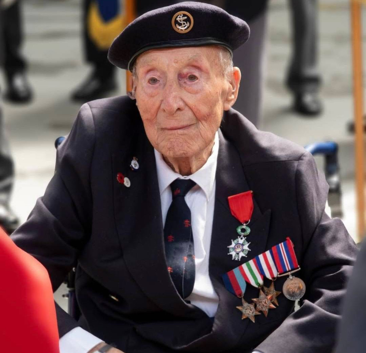 Pictured is Joe Thomas, a WWII Royal Navy veteran. He is dressed in his military uniform with associated medals.